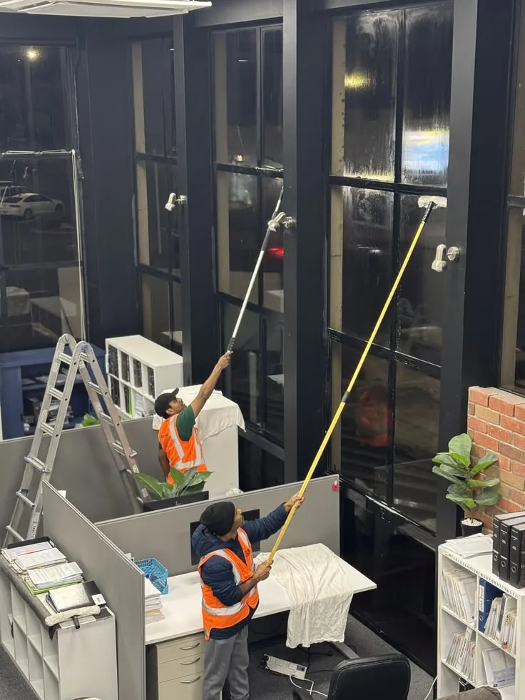 Braxen crew cleaning high office windows